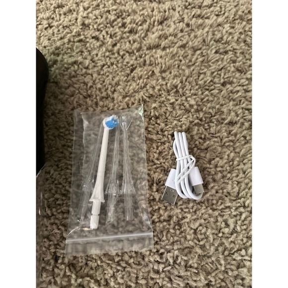 Water Flosser with 310ml Tank, 4 Nozzle Tips, 4 Pressure Settings, USB Rechargea - Picture 9 of 11